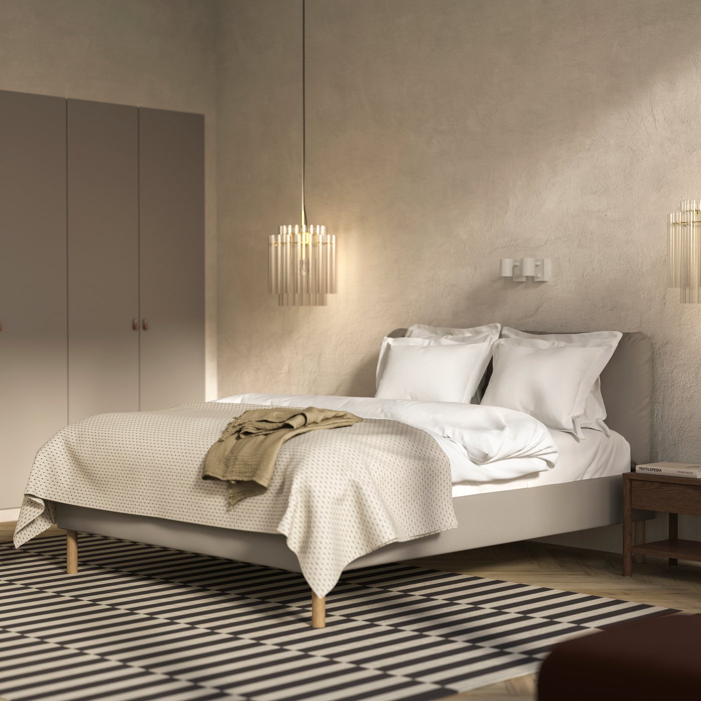 An airy, modern bedroom has an inviting bed with a SAGESUND upholstered bed frame in Diseröd brown, on a big striped rug.