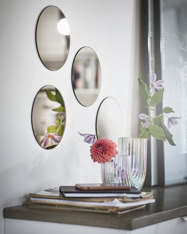 A grey FÄRGEK decorative mirror