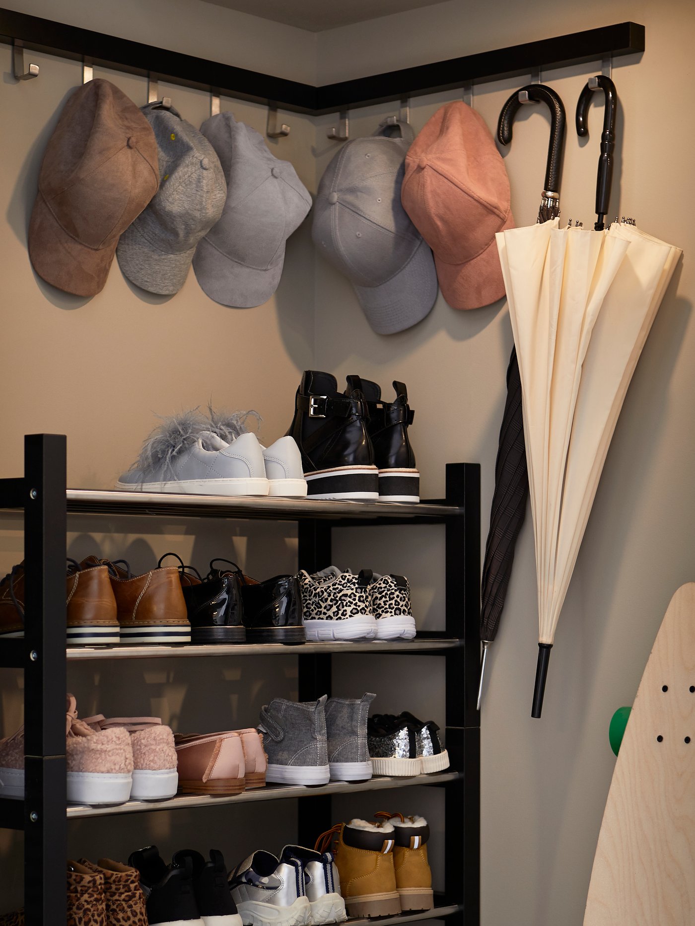 A black TJUSIG shoe rack in the hallway