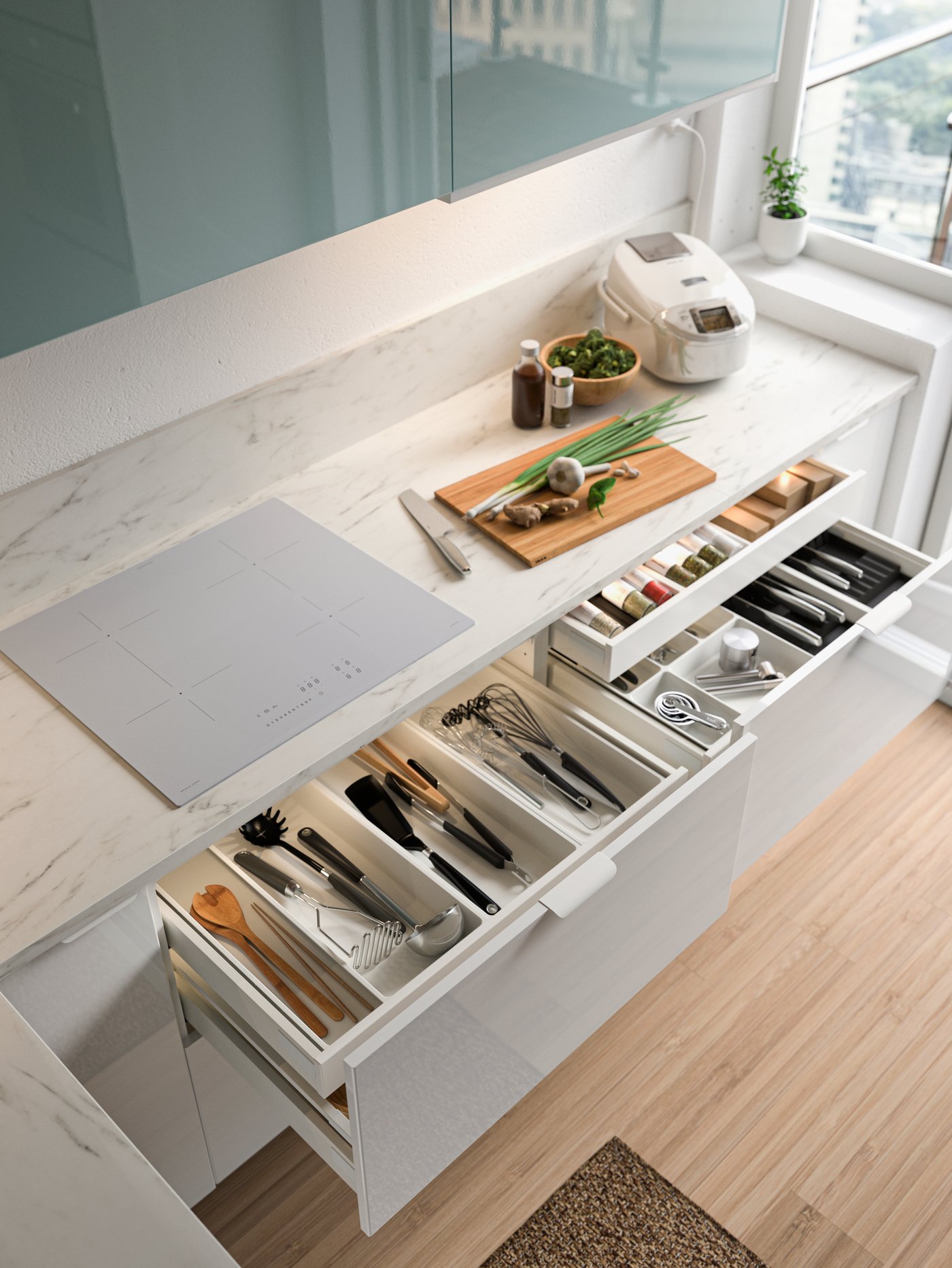 Kitchen cabinet with open drawers and organisers with kitchen accessories