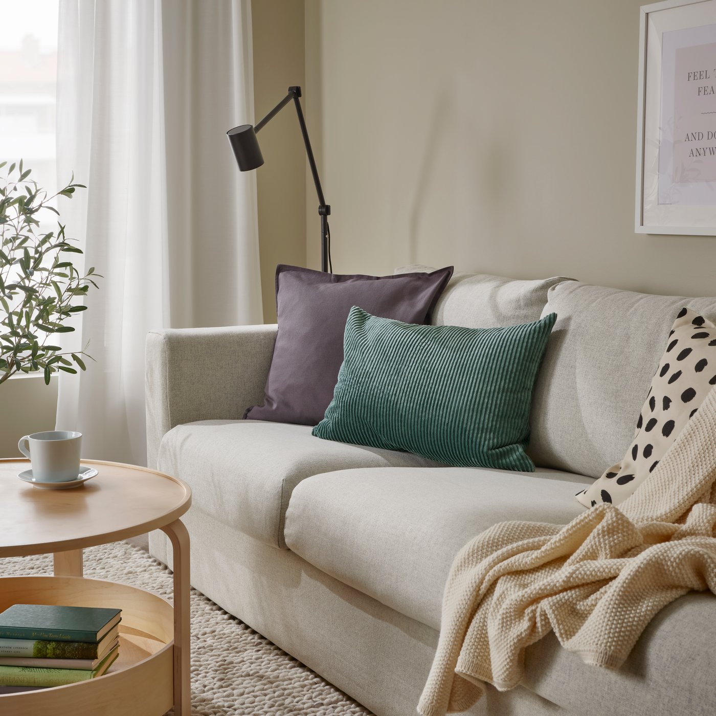 A gunnared beige VIMLE 3-seater sofa-bed at the living room. 