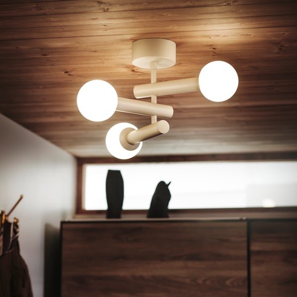 KRANBALK ceiling lamp in beige and white with PAX/MEHAMN wardrobe in the background.