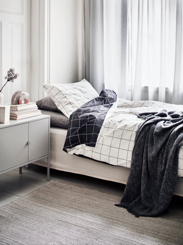A white TIBAST curtains, 1 pair in the bedroom