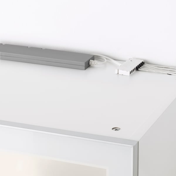 Lighting above a white cabinet with an ANSLUTA driver