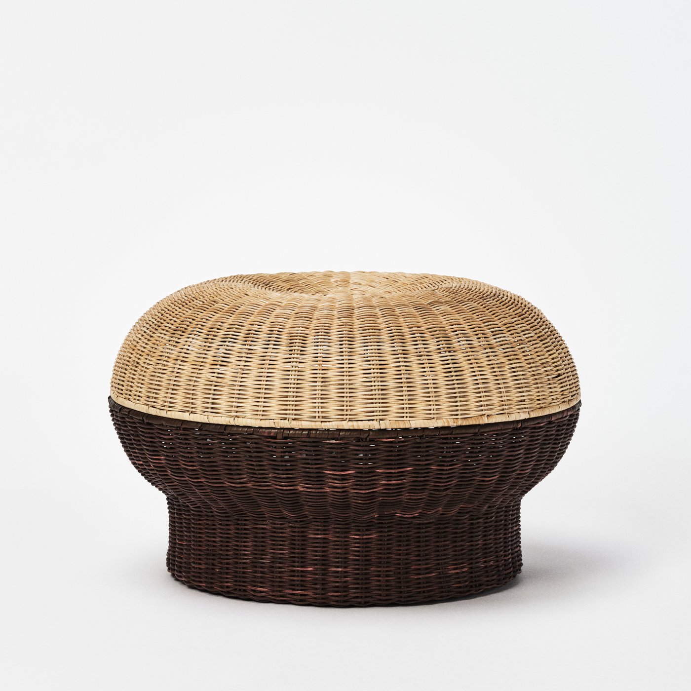 An IKEA PS 2026 footstool with storage, made from rattan.