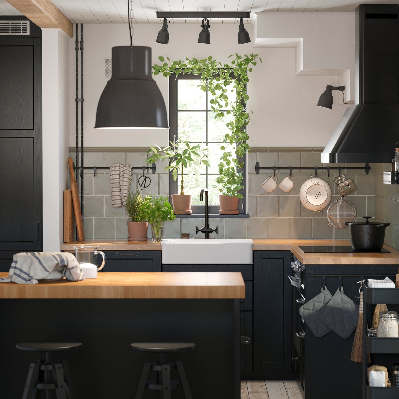 A black/oak VADHOLMA kitchen island