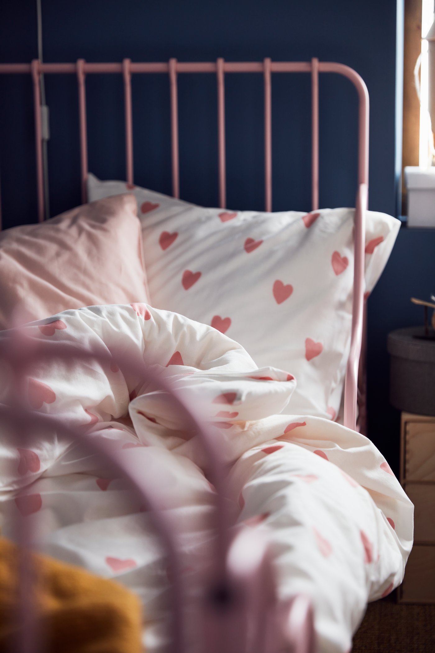 A light pink DVALA pillowcase in the childrens room