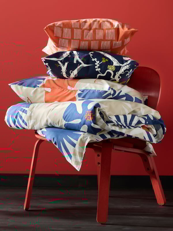An orange PALPLJUNGMAL cushion cover in the NA