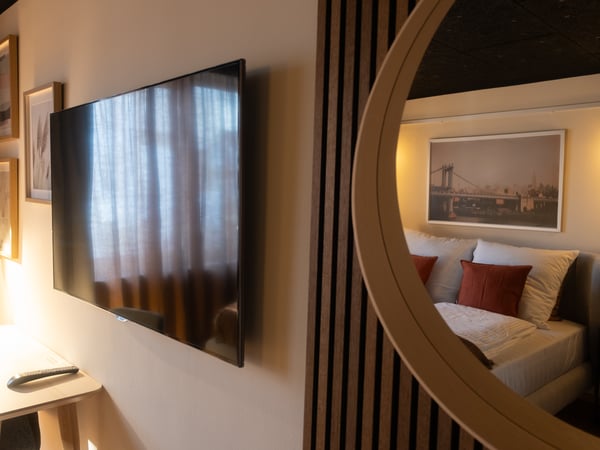 A gold-colour LINDBYN mirror