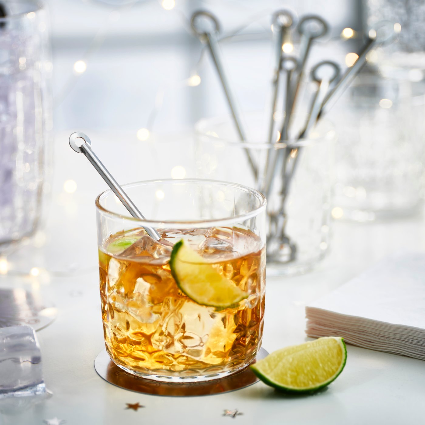 A stainless steel FRÖJDA drink stirrer