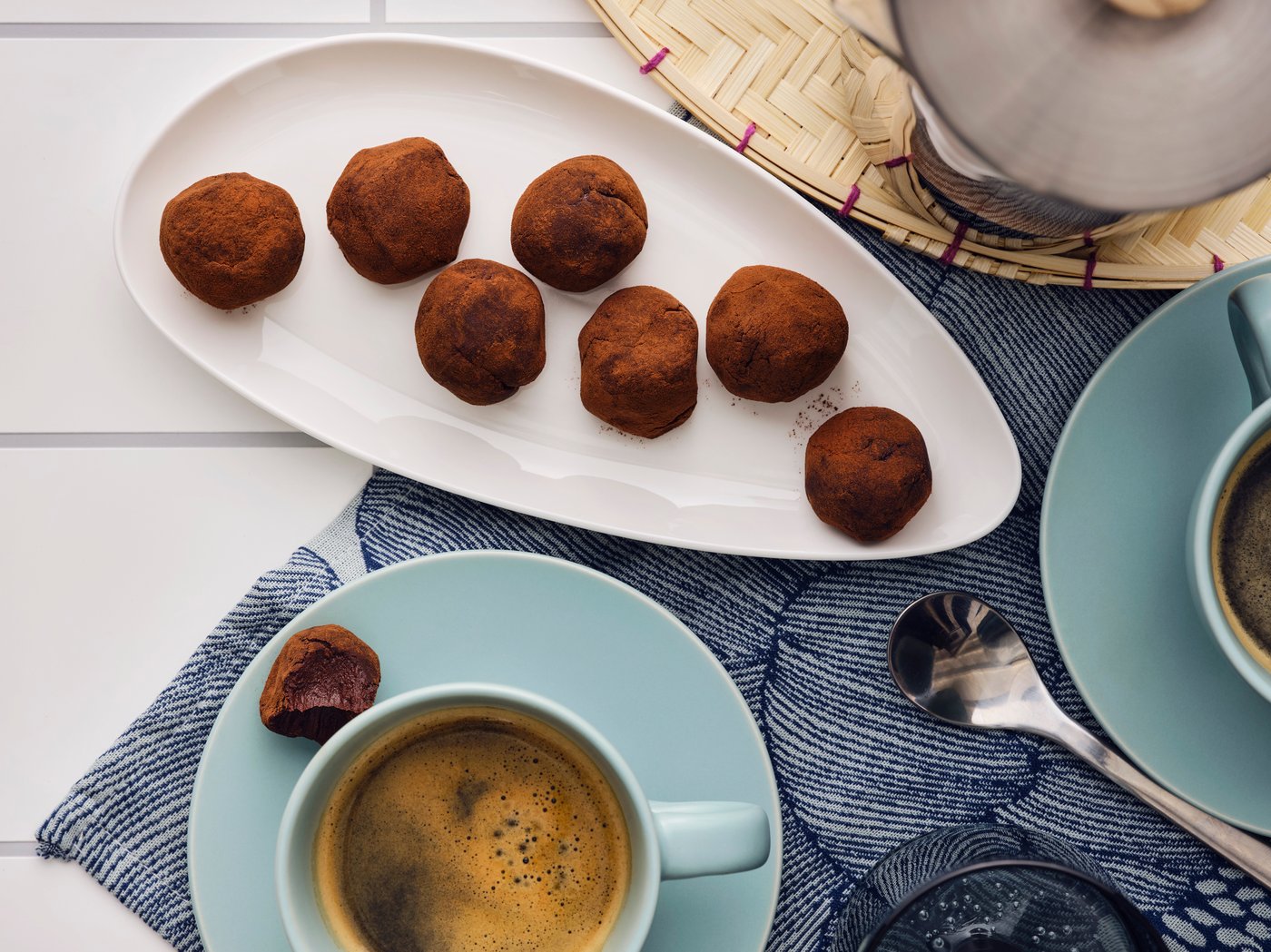 A matt light turquoise FÄRGKLAR cup with saucer