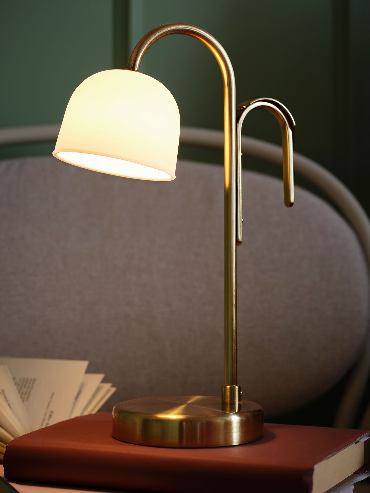 A battery-operated brass/opal white glass TVÅMASTAD LED portable lamp in the NA