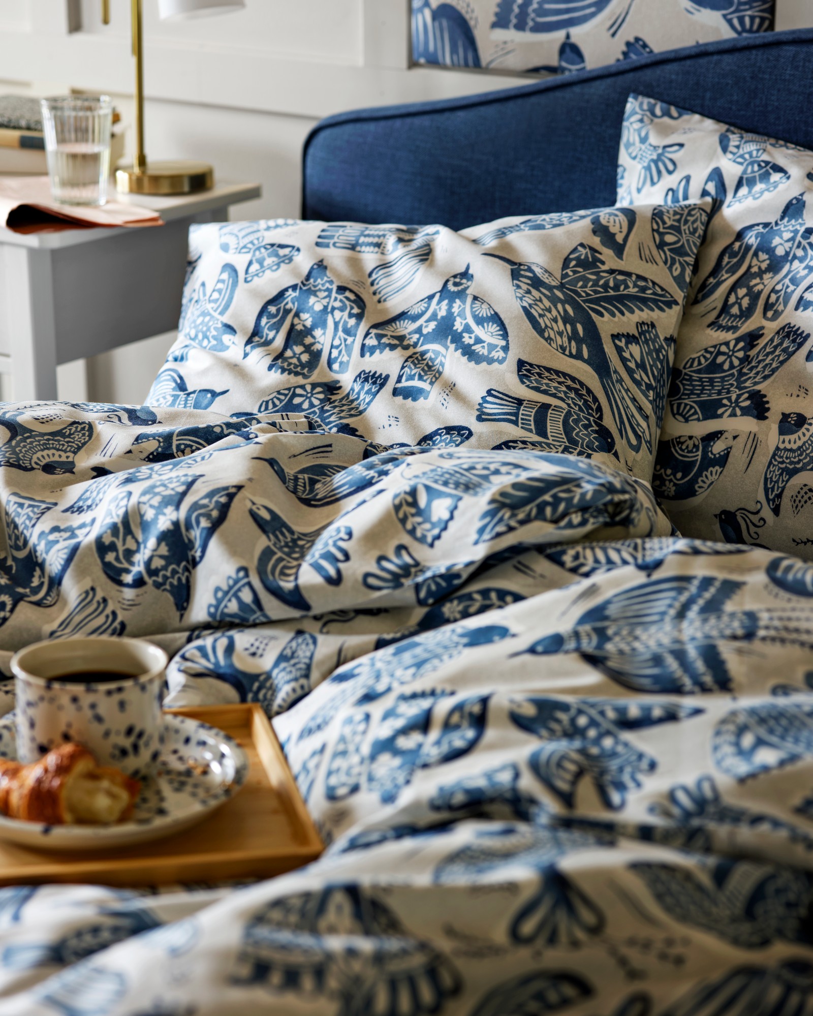 A beige/blue/bird pattern BITTERSÖTA pre-cut fabric in the bedroom