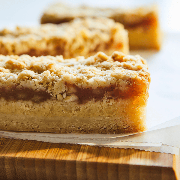 A close up image of a slice of Swedish apple cake.