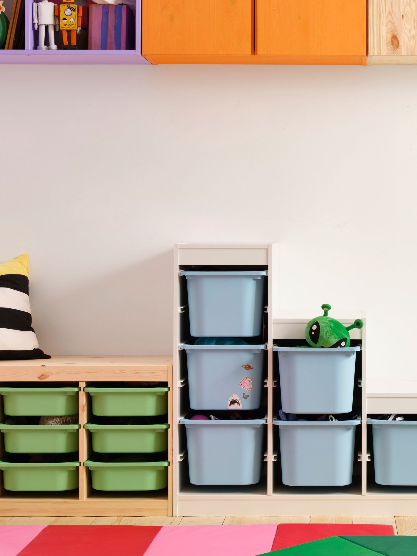 A light white stained pine TROFAST wall storage in the childrens room