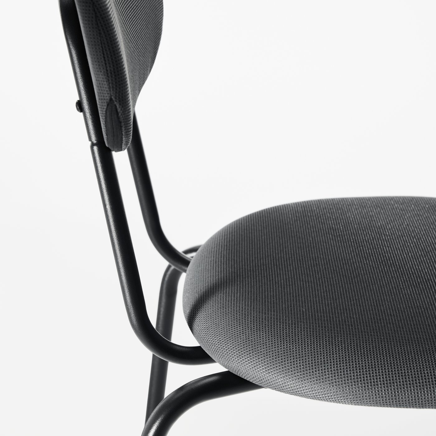 A close-up of a SANDSBERG chair in anthracite/Remmarn anthracite with padded, upholstered seat and backrest.