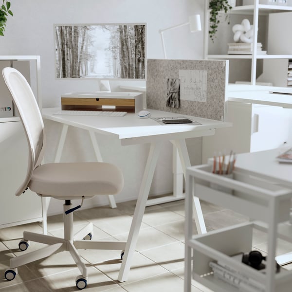 A beige FLINTAN office chair