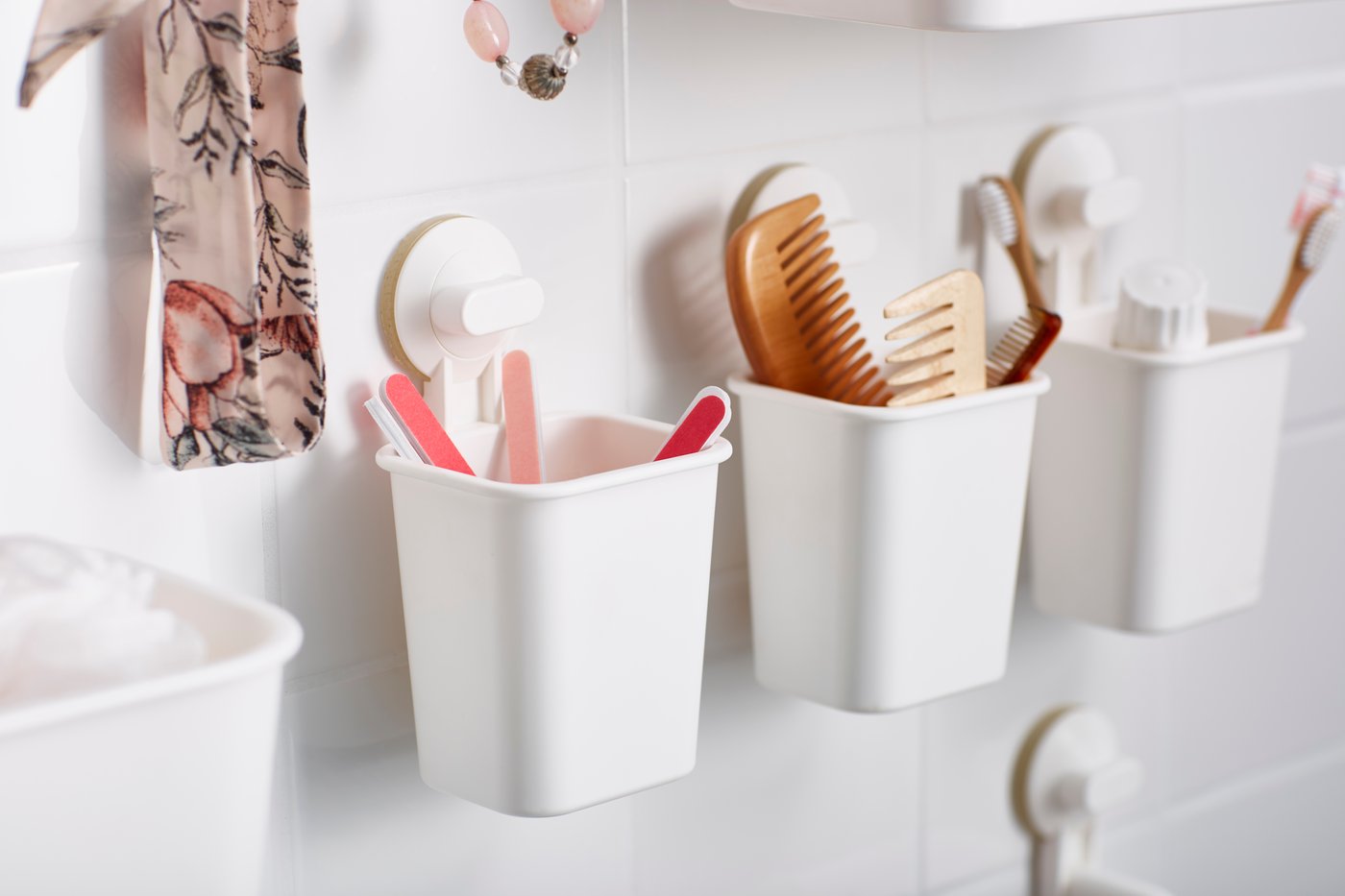 A white STUGVIK toothbrush holder with suction cup in the bathroom