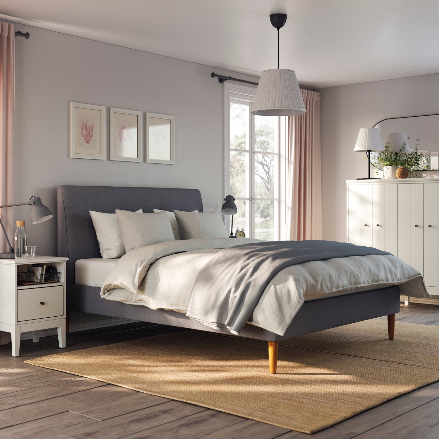A Gunnared dark grey IDANÄS upholstered bed frame in the bedroom