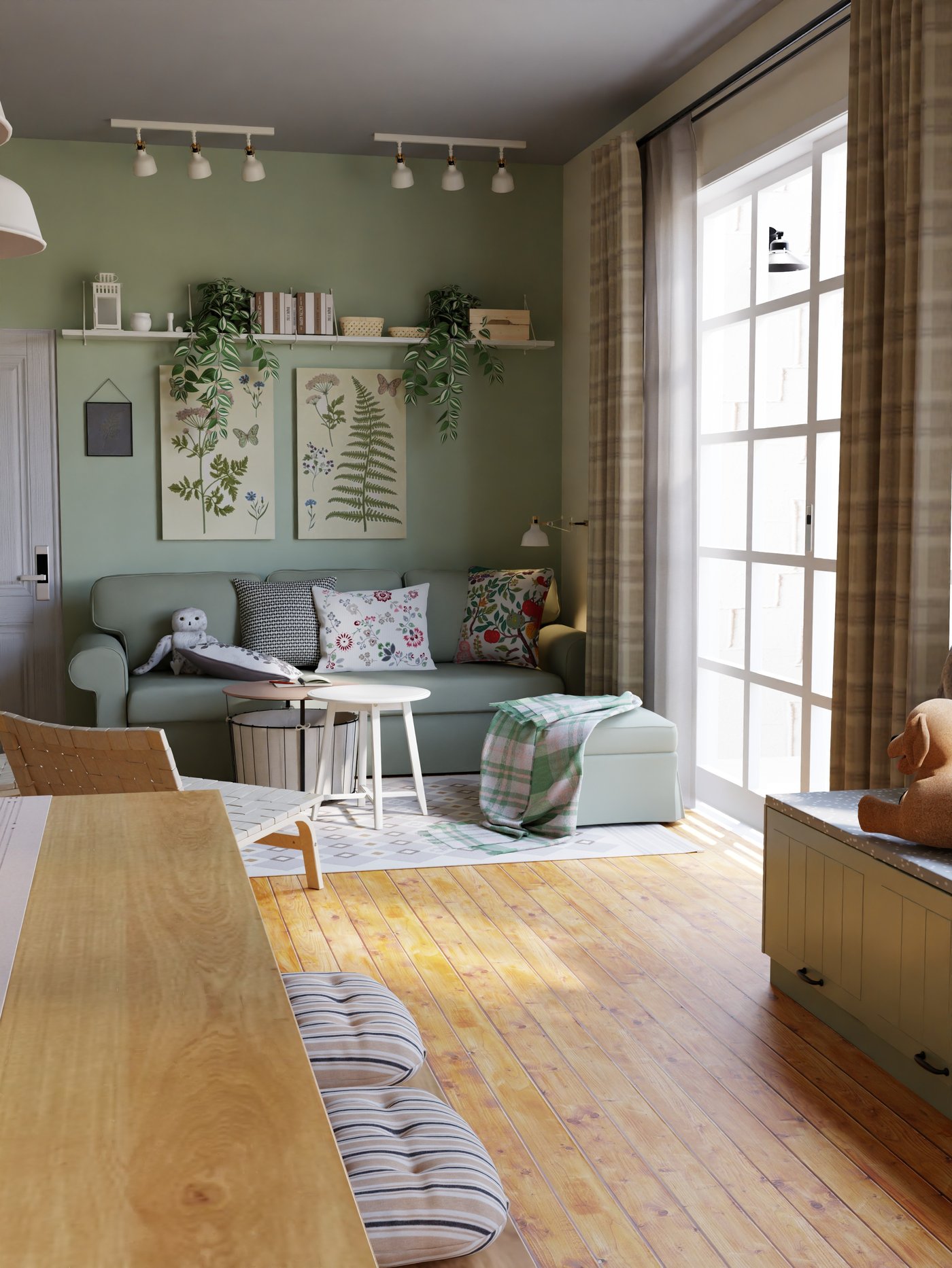 grünes Schlafsofa mit Hocker,Kissen und Decken, darüber Bilder und Regale.