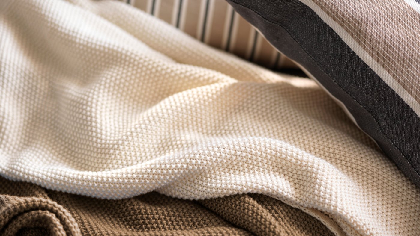 A beige white/stripe pattern KORALLBUSKE cushion cover