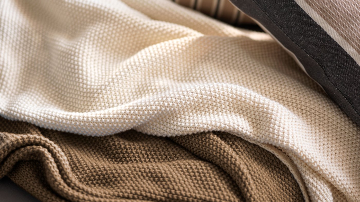 A beige white/stripe pattern KORALLBUSKE cushion cover