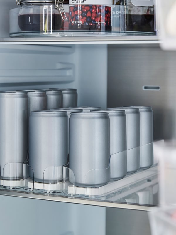 A transparent KLIPPKAKTUS drink holder for fridge