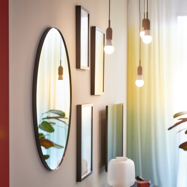 A wireless dimmable colour and white spectrum/globe opal white TRÅDFRI LED bulb E27 806 lumen