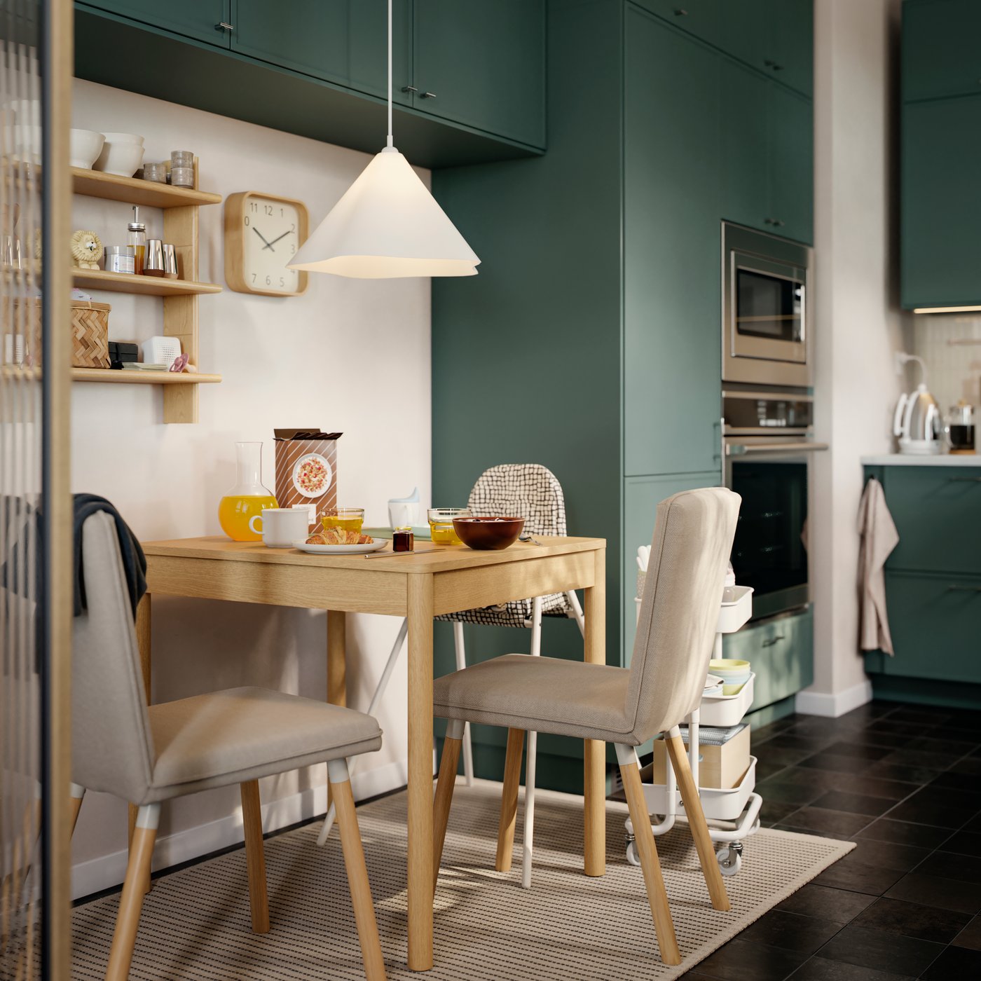 A beige/anthracite SANDKATT highchair with tray in the dining room