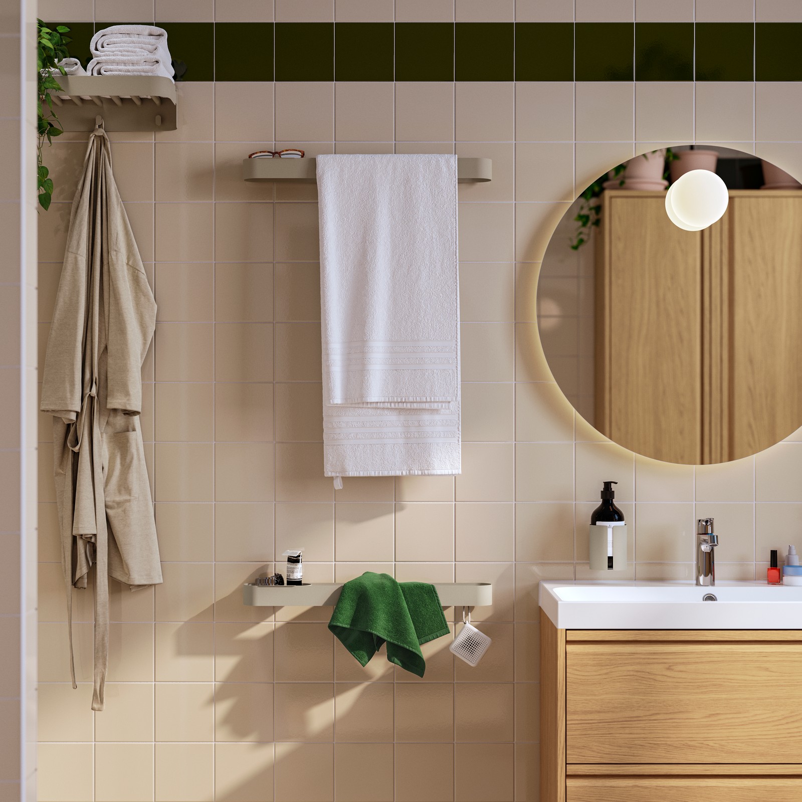 Two grey-beige coated metal FLORSJÖN towel rails are on a tiled bathroom wall, between a shower area and a wash-stand.
