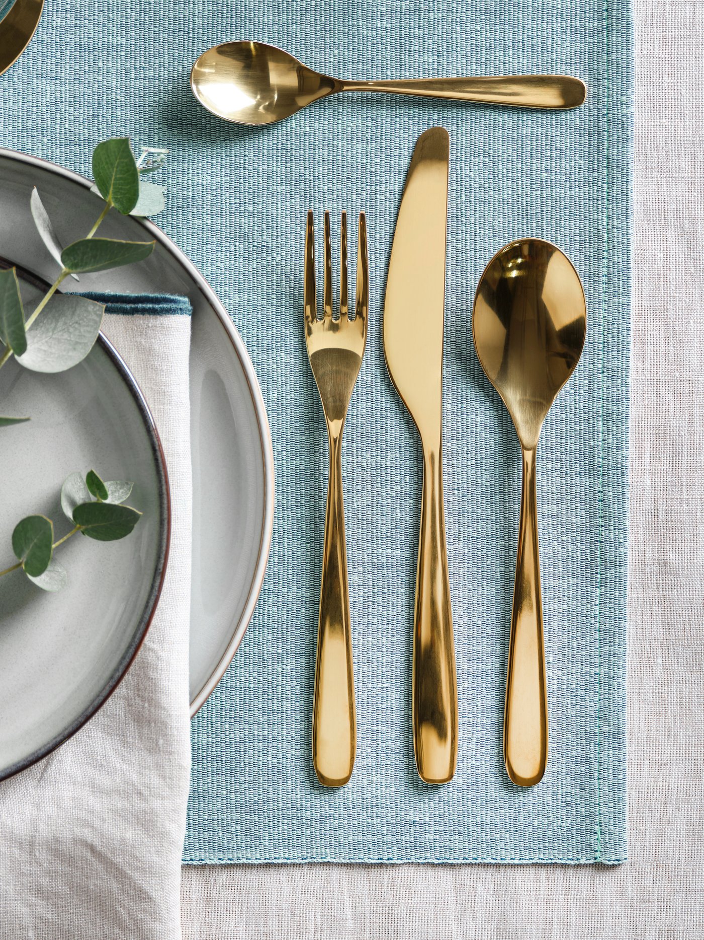 A brass-colour TILLAGD 24-piece cutlery set