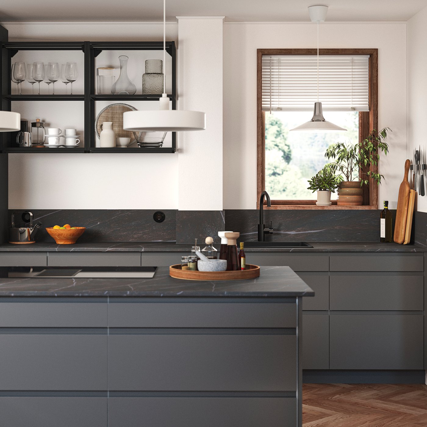 A kitchen with dark grey VOXTORP kitchen fronts.