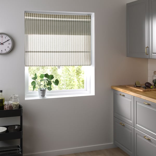 A white/green/striped RINGBLOMMA Roman blind
