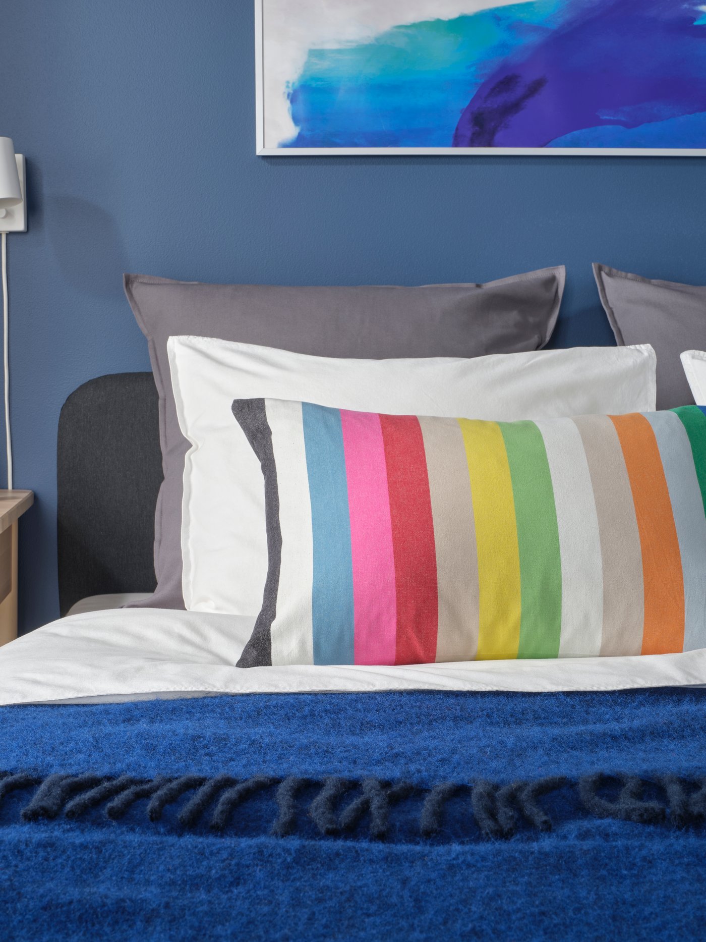 A multicolour/stripe pattern BÄCKMÄRKEN cushion cover
