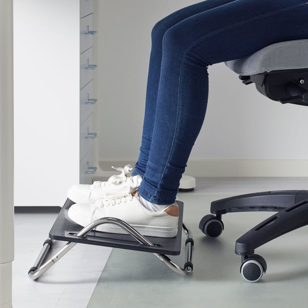 A black DAGOTTO foot-rest