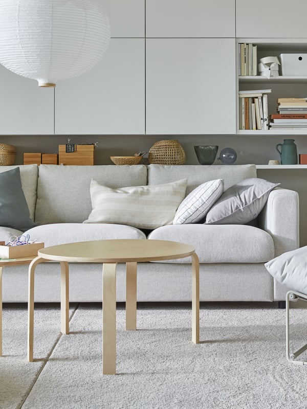 A bright scandinavian living room with a comfortable sofa.