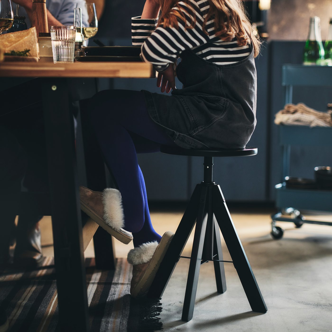 A black RUDSTORP stool in the dining room