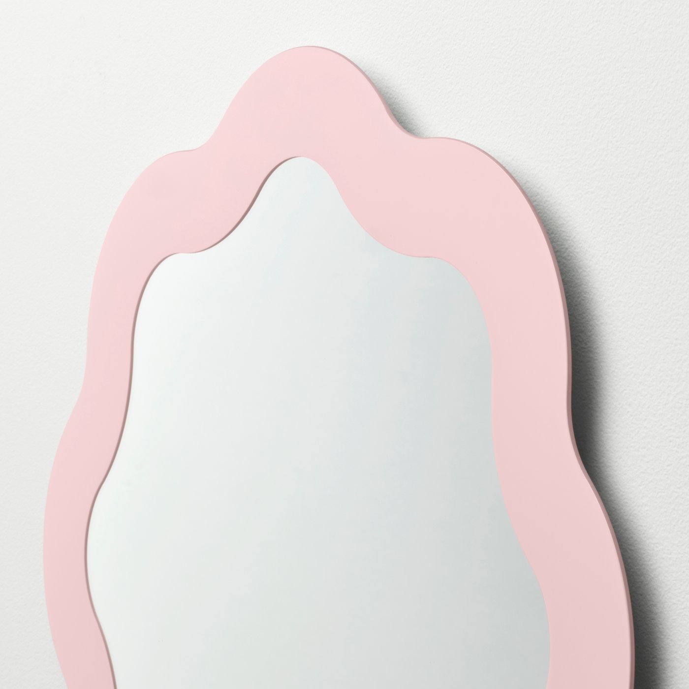 A light pink PRUNKHALLON mirror