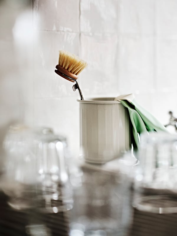A beige/galvanised VÄLVÅRDAD cutlery stand