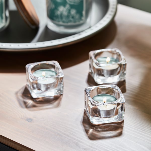 A bergamot & cedarwood/pale green BUKETTAPEL scented candle in glass