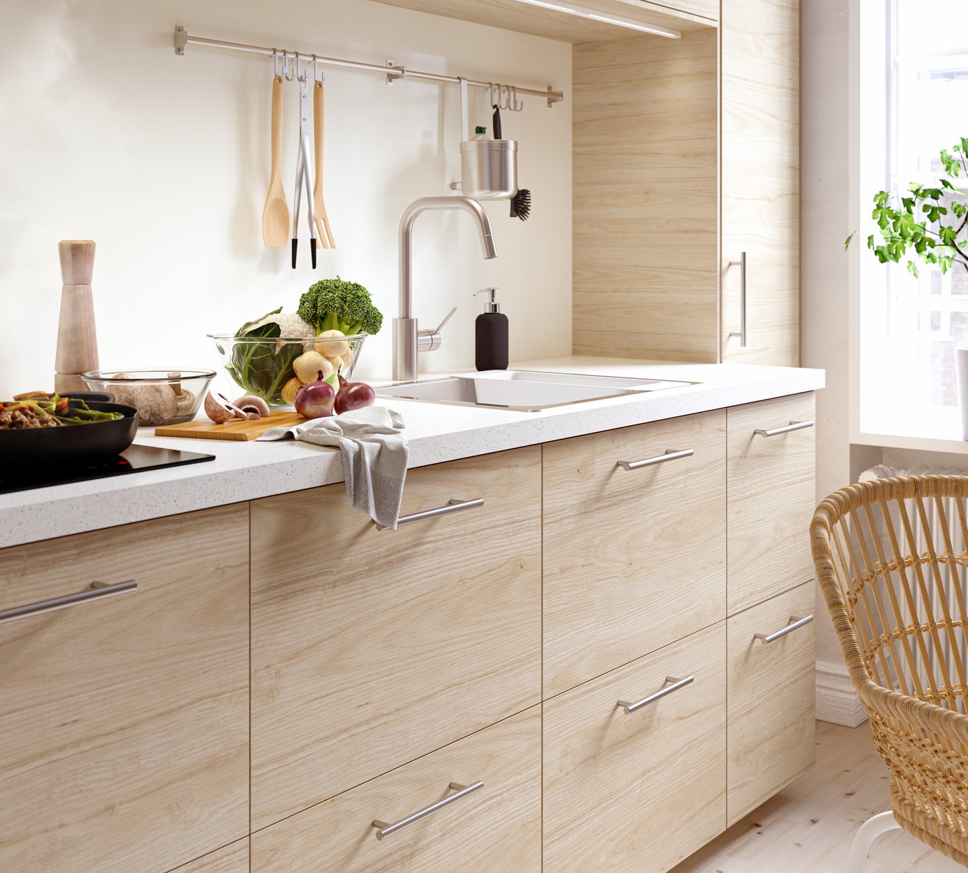 A light ash effect ASKERSUND drawer front in the kitchen