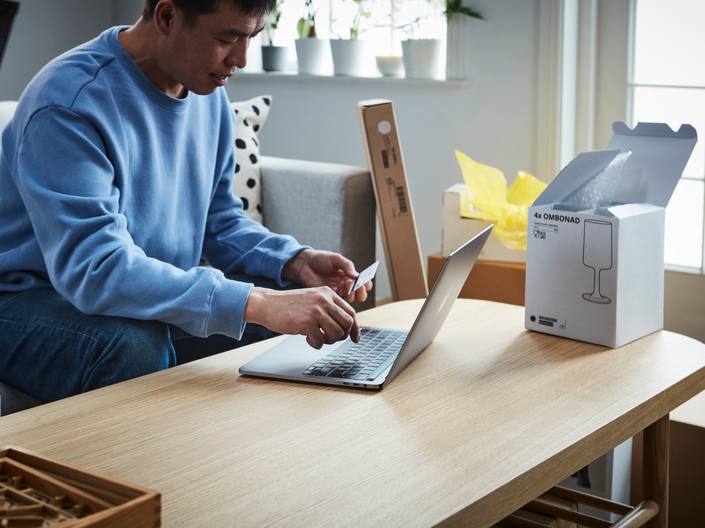 man typing on laptop