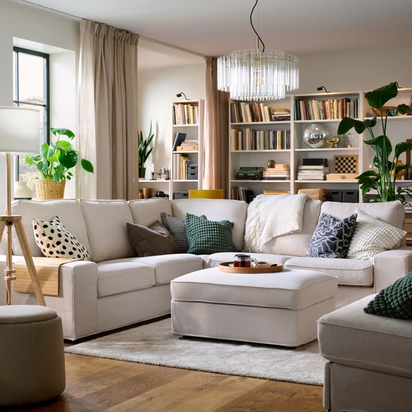 An anthracite/off-white GULDFLY cushion cover in the living room