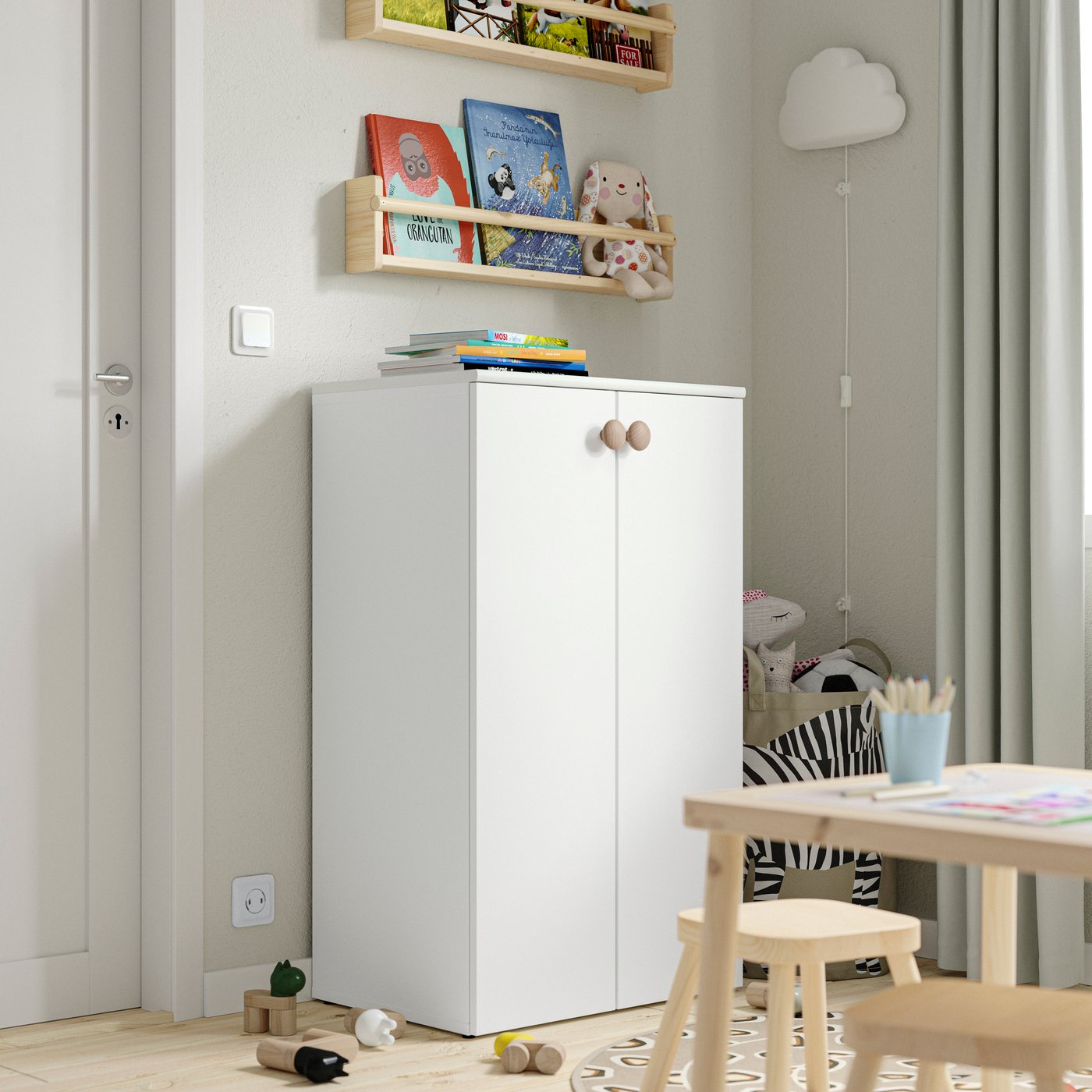 A white LASTARE storage combination in the childrens room