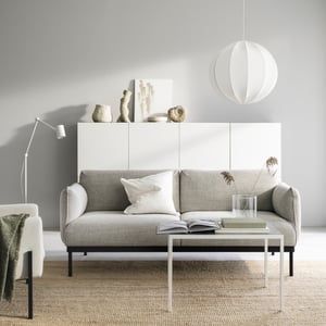 A Lejde light grey ÄPPLARYD 2-seat sofa in a livingroom with a white cabinet and a beige mat
