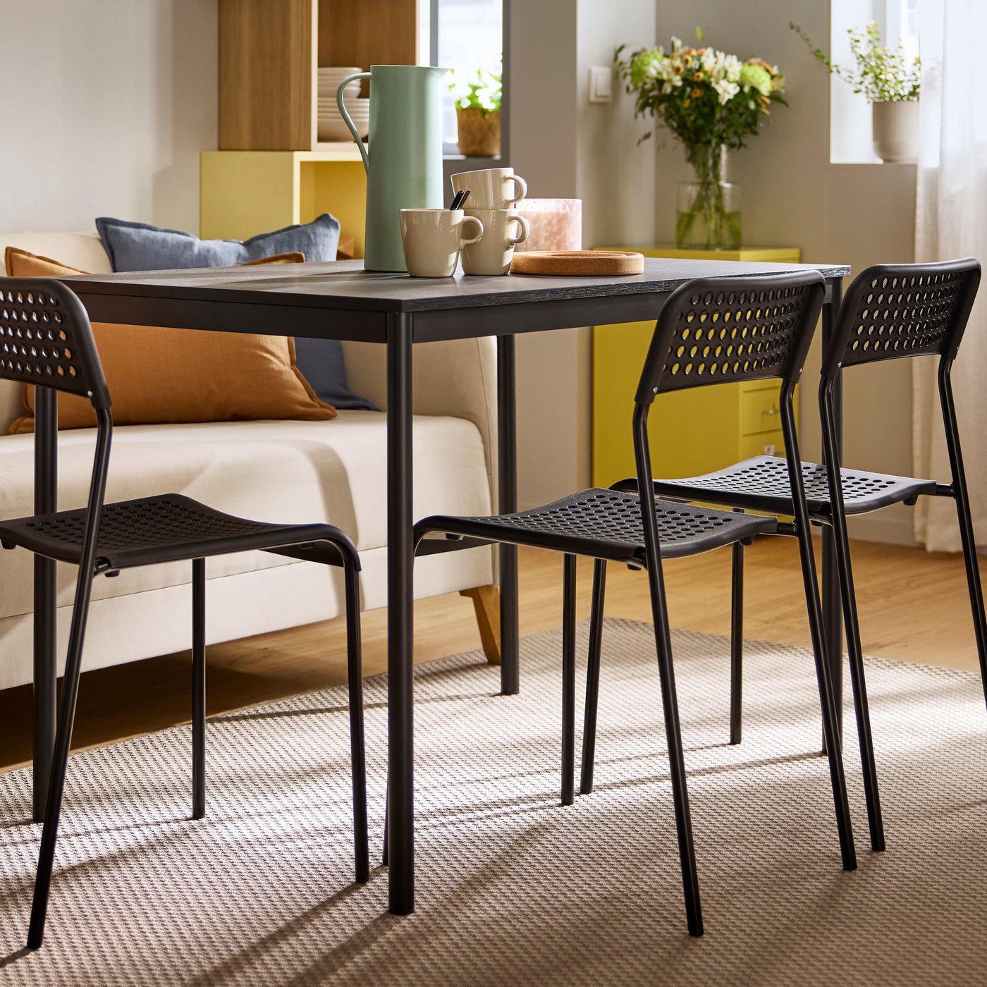 A black black/black SANDSBERG table and 4 chairs in the dining room