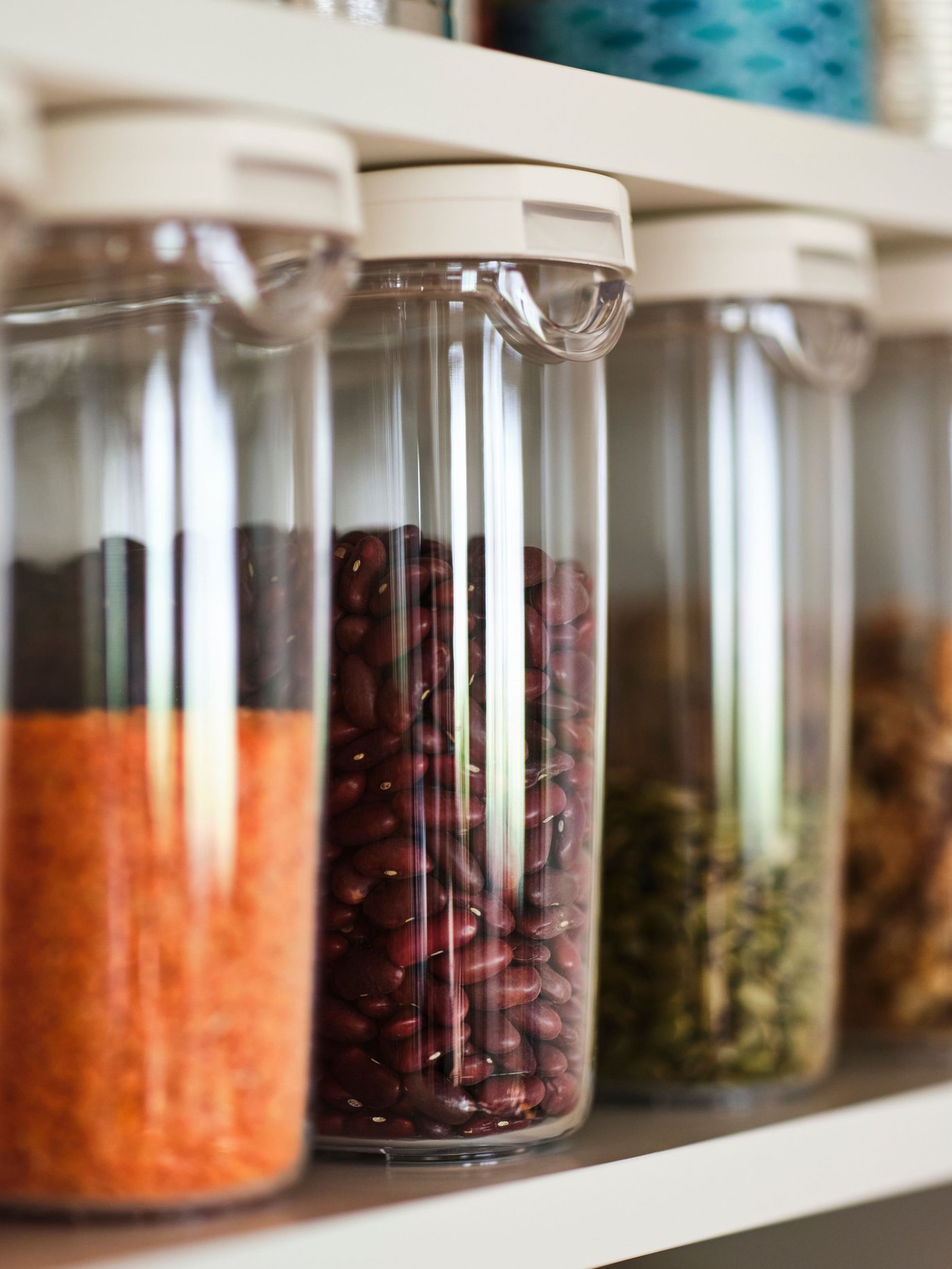 A transparent/white IKEA 365+ dry food jar with lid