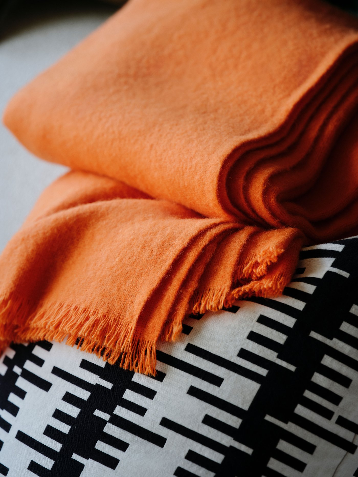 An off-white/black STOCKHOLM 2025 cushion cover