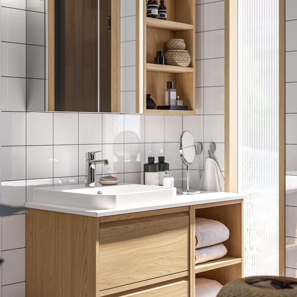 A LETTAN mirror cabinet with doors and a HAGAÅN wall open cabinet above an ÄNGSJÖN/BACKSJÖN wash-stand/wash-basin/tap.