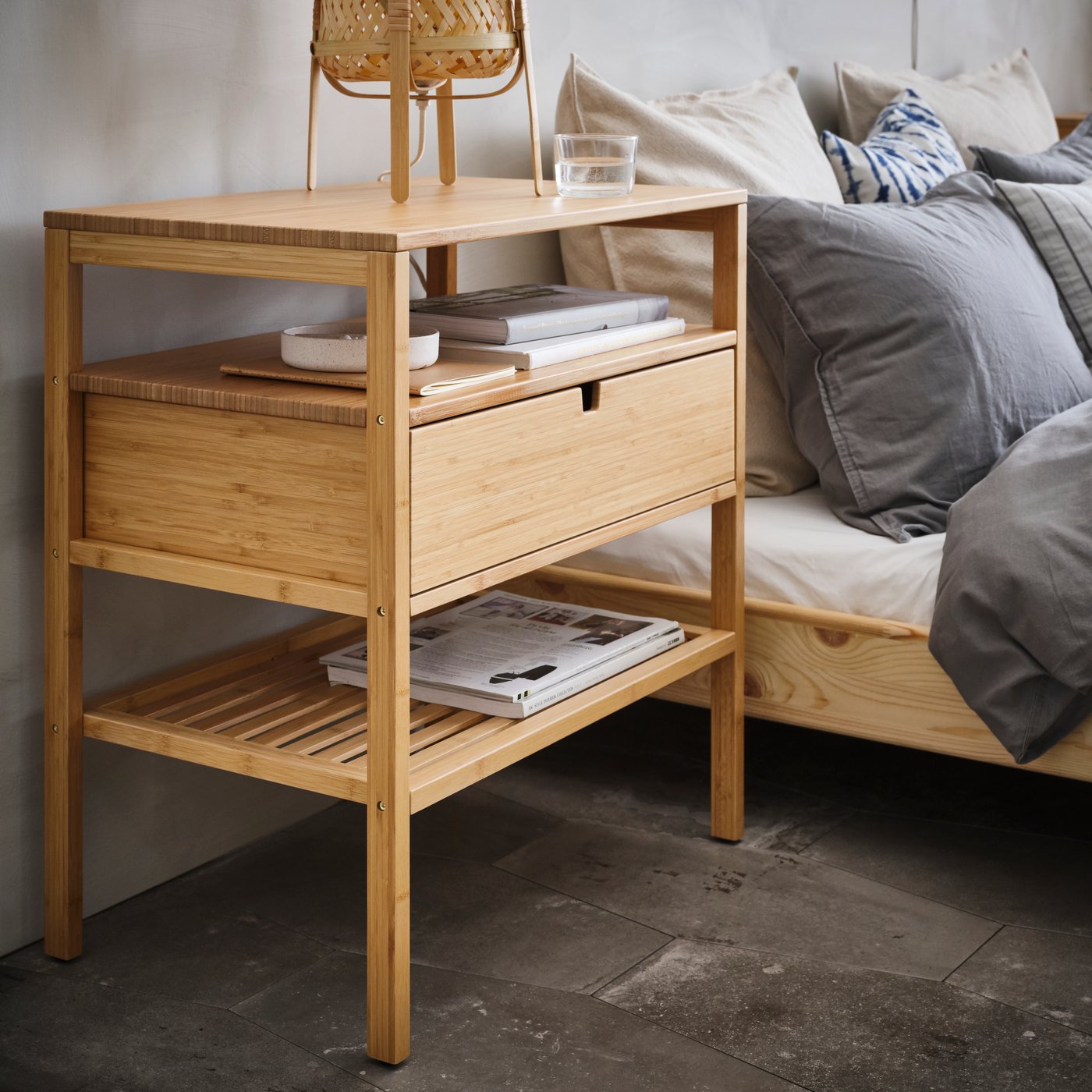 A bamboo NORDKISA bedside table in the bedroom